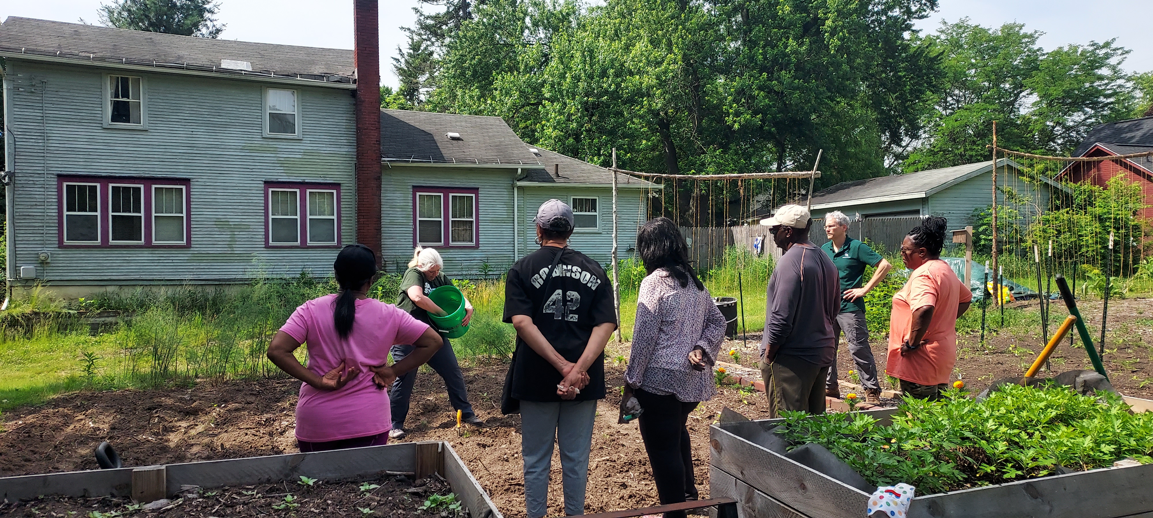 People standing in an urban garden.